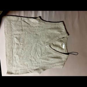 Short sleeve sweater vest in beige.